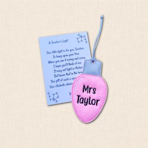 Pink felt light bulb decoration personalised with 'Mrs Taylor', displayed with an 'A Teacher's Light' Christmas poem card.