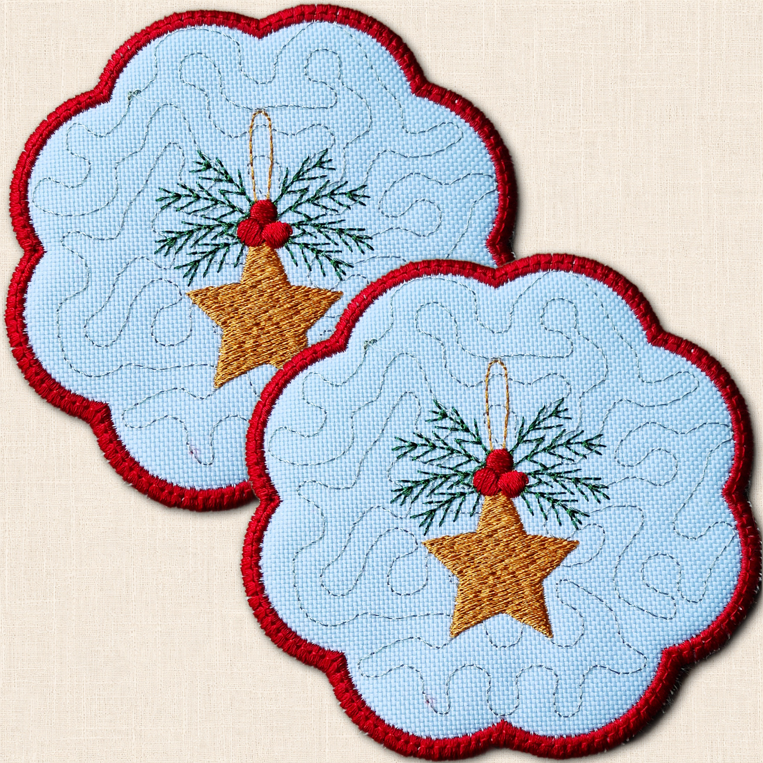 Two overlapping Christmas star candle coasters with embroidered golden stars, green foliage, red berries and scalloped red borders.