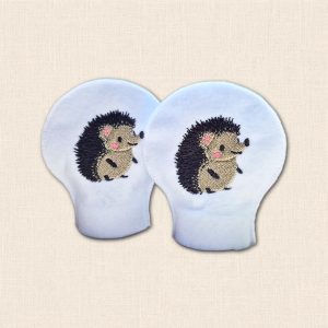 Pair of white felt LED tealight covers embroidered with smiling hedgehogs, dark prickles, beige bodies and pink cheeks.