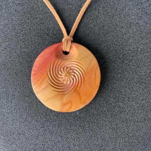 Handcrafted pendant crafted from yew wood