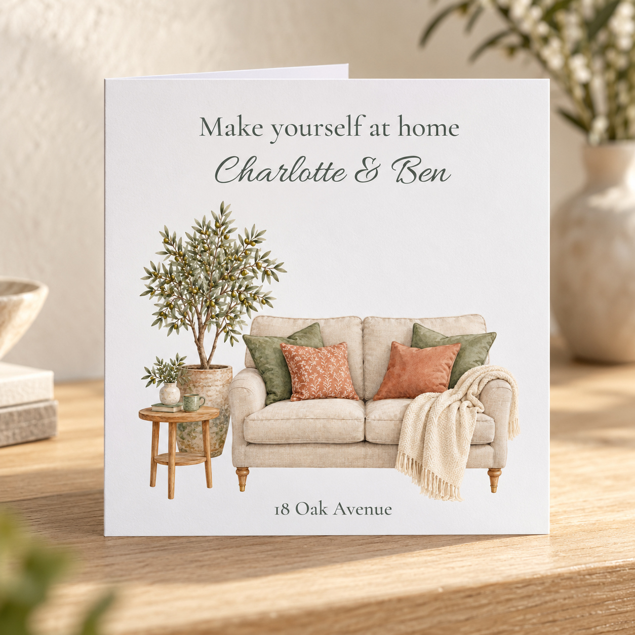 Personalised new home card with watercolour cosy sofa, olive tree, names and address