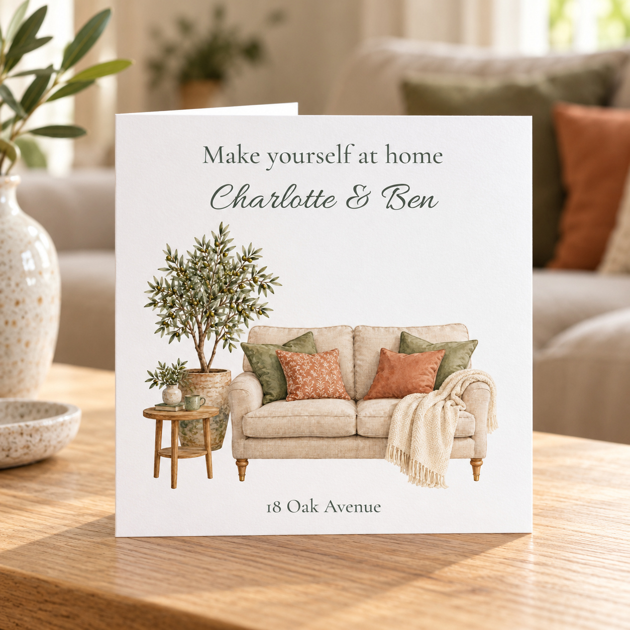 Personalised new home card with watercolour cosy sofa, olive tree, names and address
